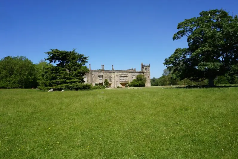 Lacock Abbey surrounded by delightful grounds