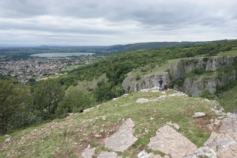Goats and visitors at the top of Cheddar Gorge enjoying the beautiful views of the gorge and of Somerset