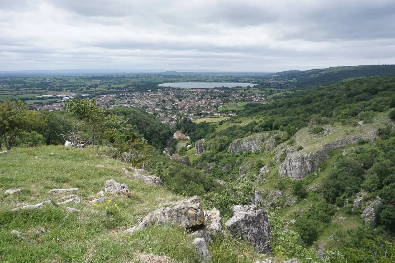 The cliffs of Cheddar Gorge and the spectacular views of the village of Cheddar and the Somerset Levels