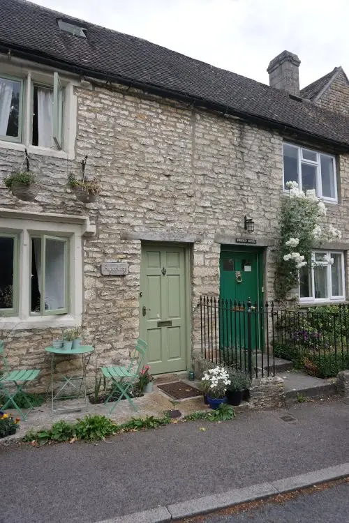 Typical Cotswold cottages in Bisley with colourful doors