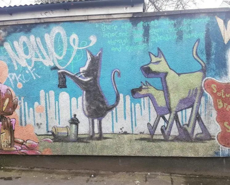 Banksy graffiti in Easton in Bristol Cat & Dog