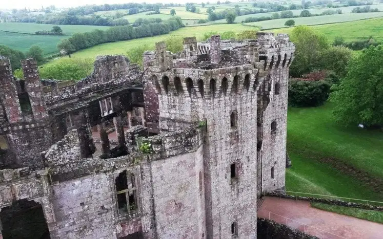 Raglan Castle, its octogonal towers and surrounding countryside