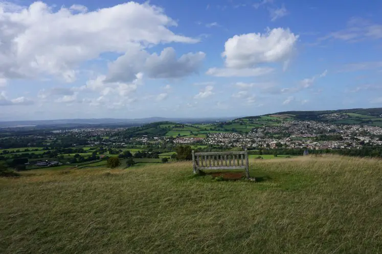 A bench with views of the Cotswold Hills and Stroud on Selsley Common