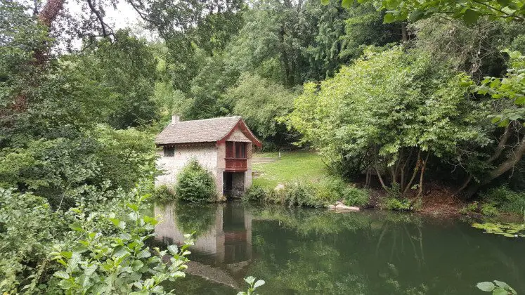 Boathouse, lake and woods in Woodchester Park near Stroud