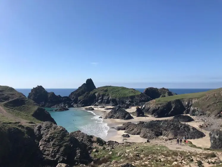 The beautiful turquoise waters, white sand and rugged cliffs of Kynance Cove on the Lizard Peninsula in Cornwall