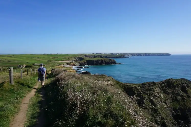 Walking along the South West Coastal Path to Church Cove Beach in South Cornwall