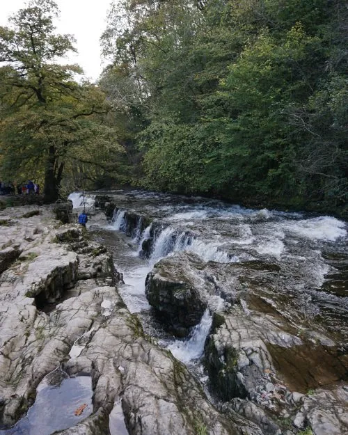 View of Sgwd Isaf Clun-Gwyn waterfall from upriver