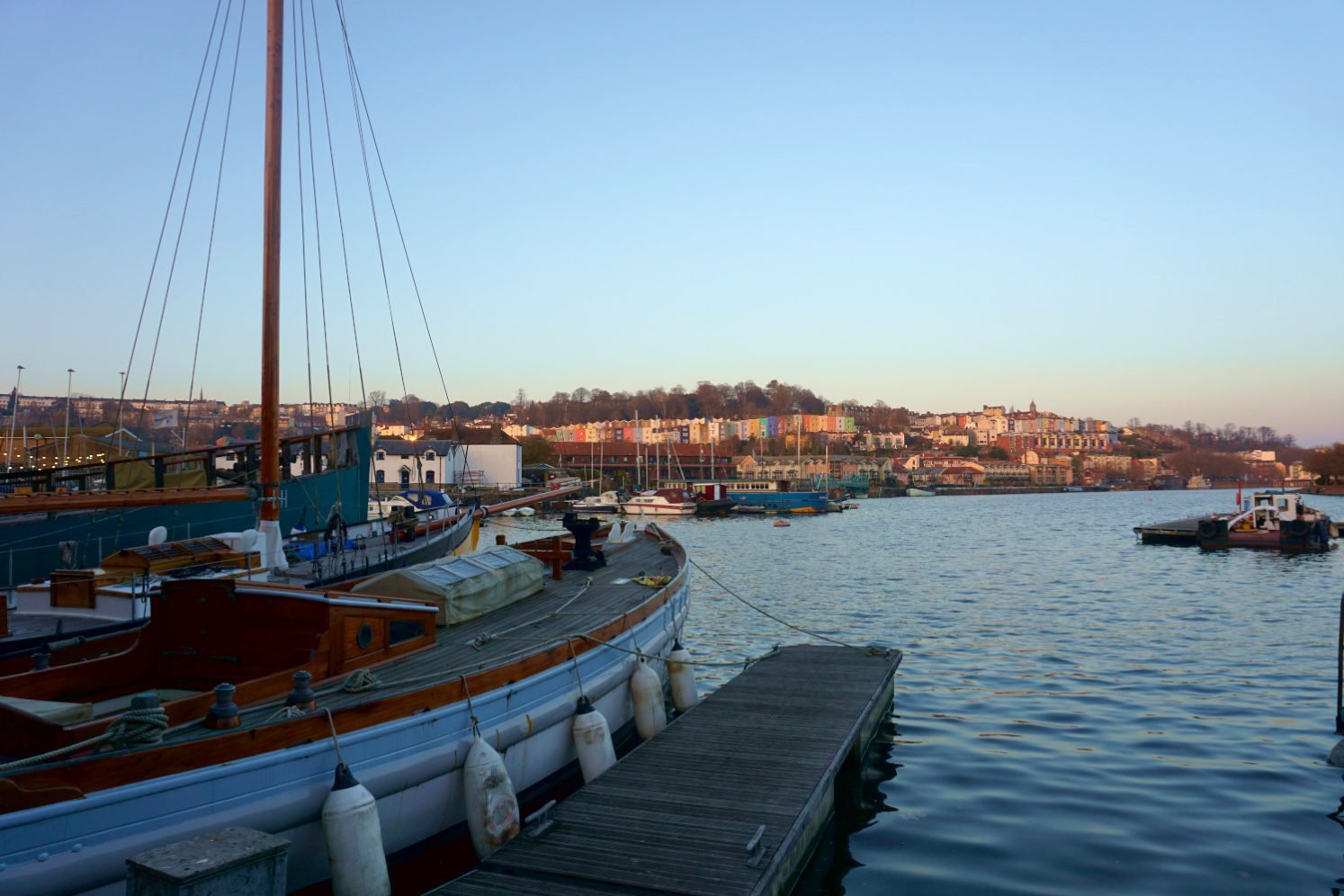 View from Bristol's Harbourside of moored boats and Hotwell's colourful houses