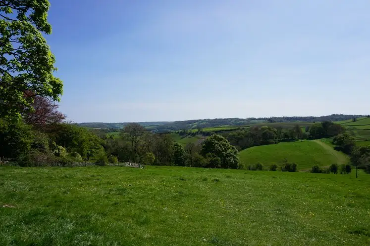 Views of rolling fields and Cotswold hills from Cold Ashton