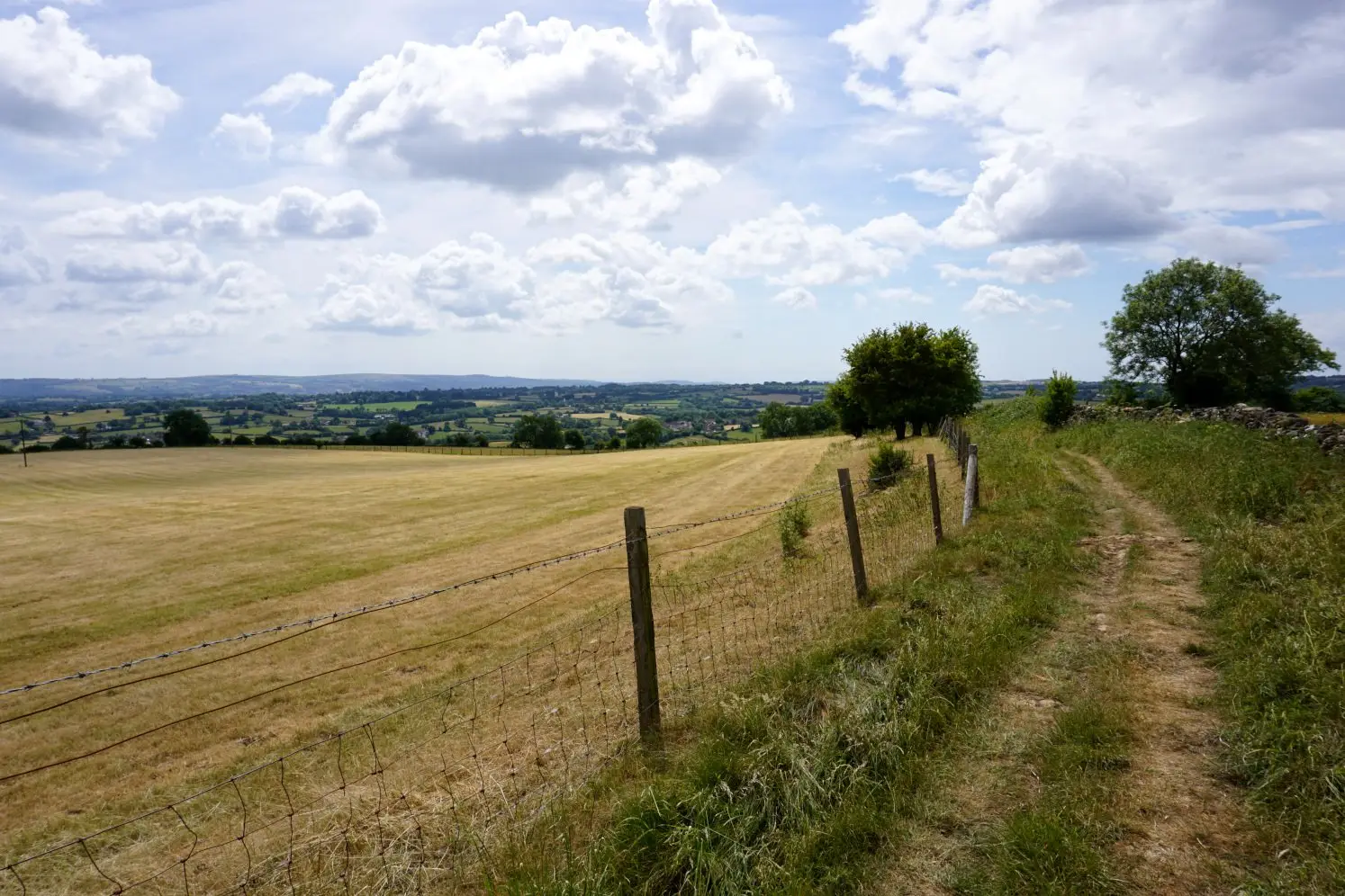 A charming country lane with views of the rolling Somerset hills near Bath and Bristol