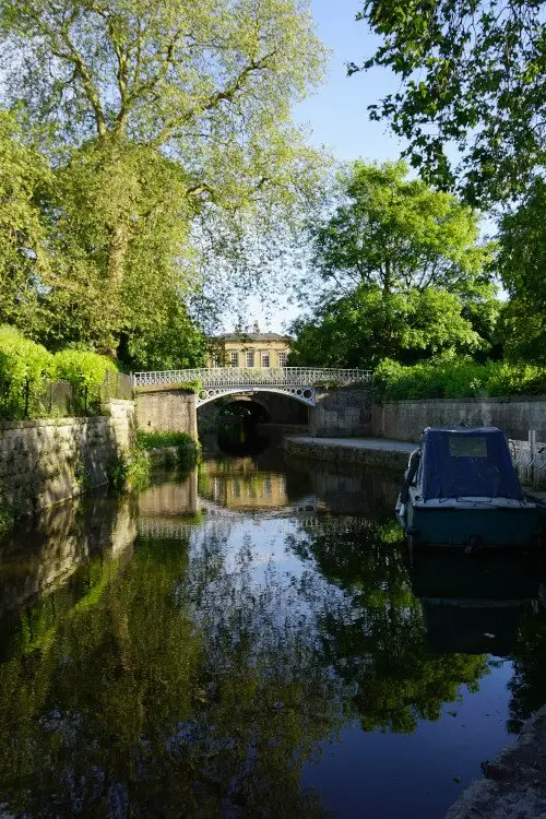 The Kennet & Avon canal flowing through the Georgian park of Sydney Gardens, a stop in the Bath walking tour