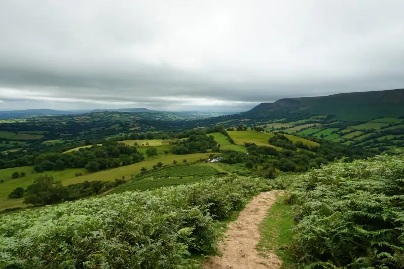 The start of the Black Hill & Hay Bluff walk with views of the Herefordshire countryside and the Brecon Beacons mountains