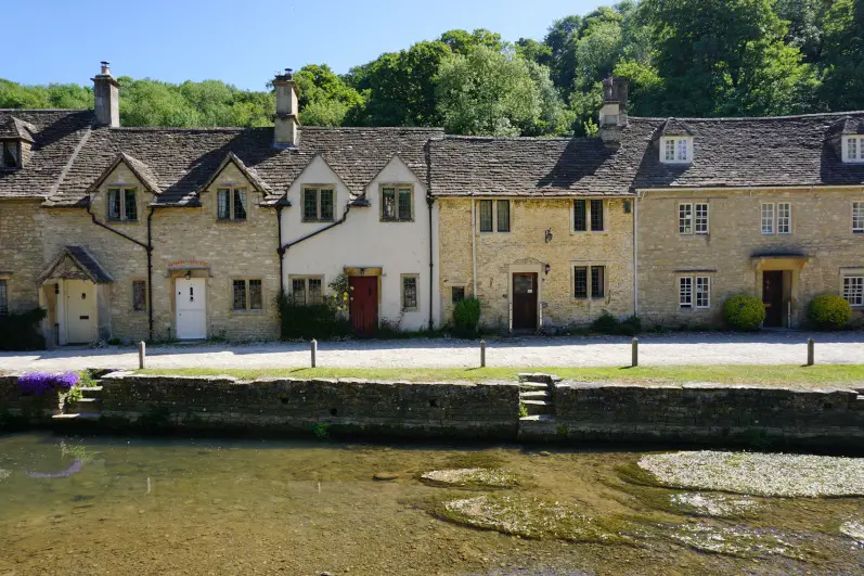 Cotswold cottages along the By Brook stream in Castle Combe