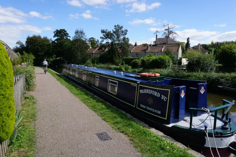 Blue canal boat on the canal in Bathampton