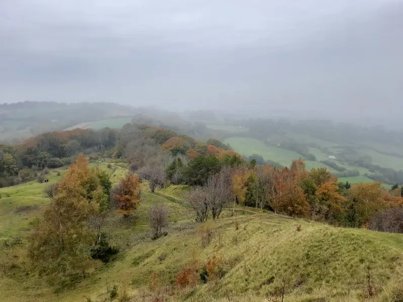 Low clouds, autumn colours and Cotswold views from Painswick Beacon